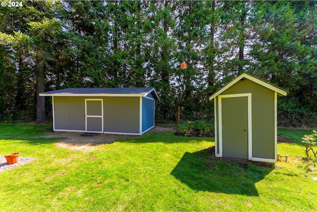 view of outbuilding with a lawn