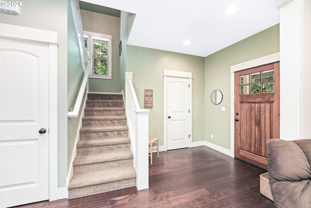 foyer with dark hardwood / wood-style floors