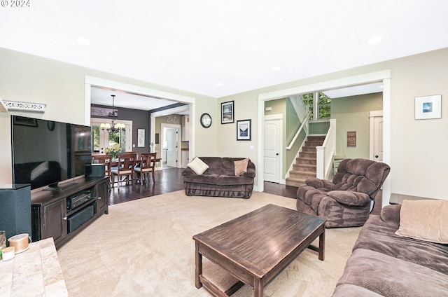 living room featuring an inviting chandelier and hardwood / wood-style floors