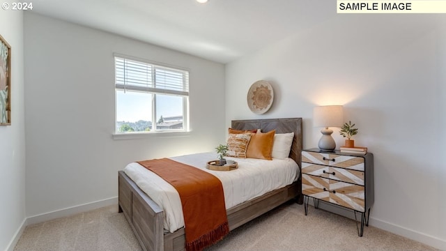 bedroom with carpet and baseboards