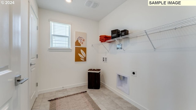 washroom featuring laundry area, baseboards, hookup for a washing machine, electric dryer hookup, and light tile patterned flooring