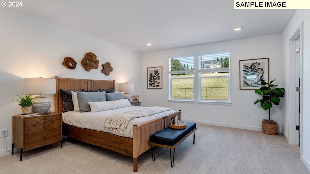 bedroom featuring recessed lighting, light colored carpet, and baseboards