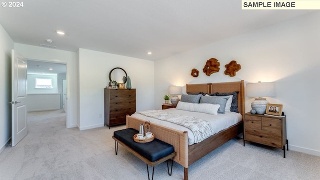 bedroom with recessed lighting, light carpet, visible vents, and baseboards