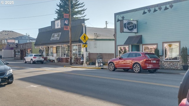 view of road with curbs and sidewalks