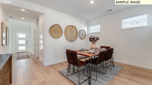 dining room with baseboards, recessed lighting, visible vents, and light wood-style floors