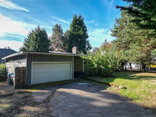 garage featuring a lawn