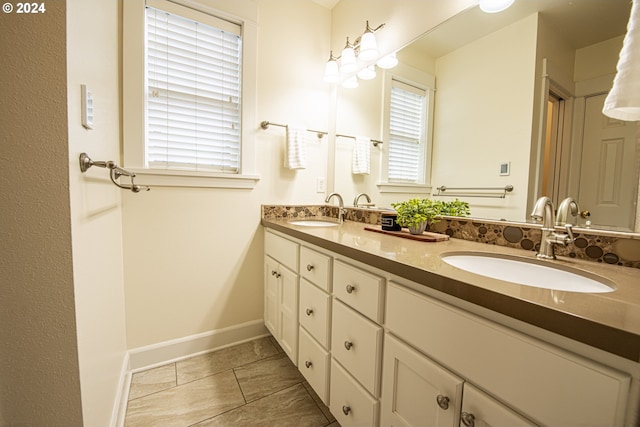 bathroom with tile patterned flooring and vanity