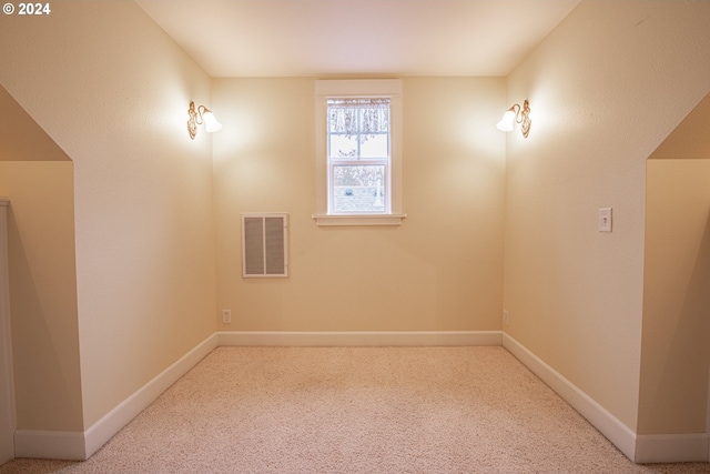 spare room featuring carpet flooring