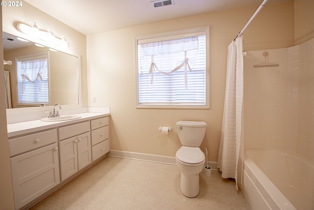 full bathroom with vanity, toilet, and shower / tub combo