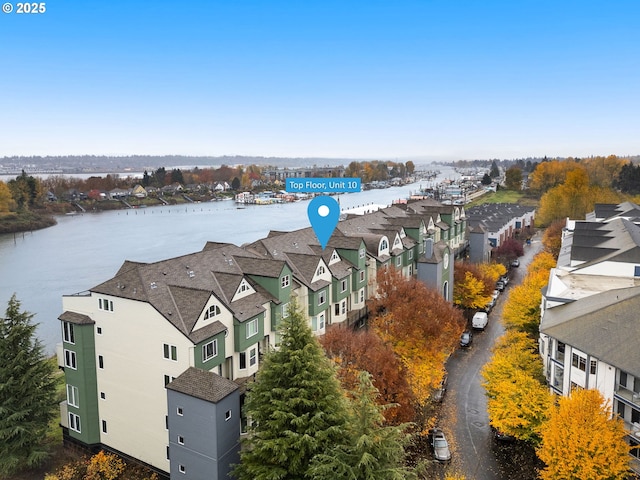 bird's eye view with a residential view and a water view