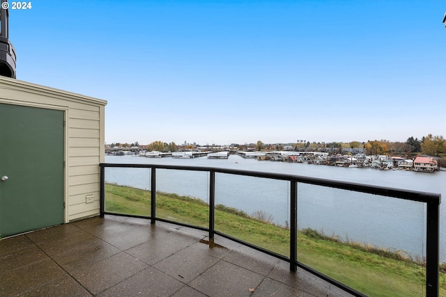 balcony featuring a water view