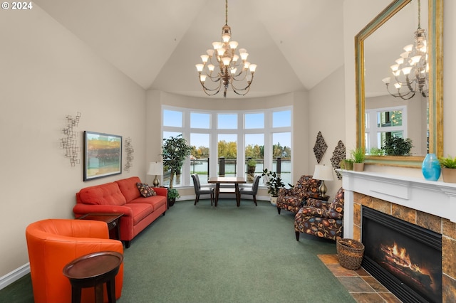 sitting room with a notable chandelier, carpet flooring, high vaulted ceiling, a tile fireplace, and baseboards