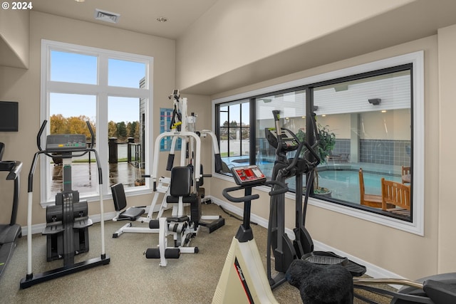 gym with visible vents and baseboards