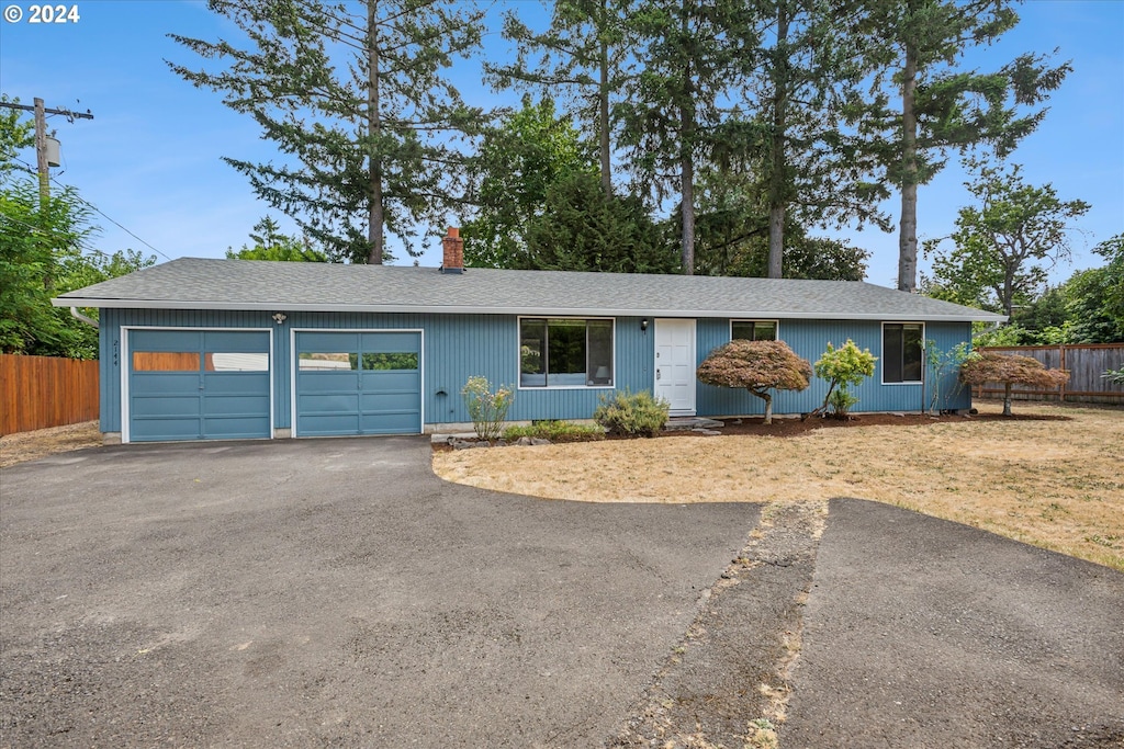 single story home with a garage