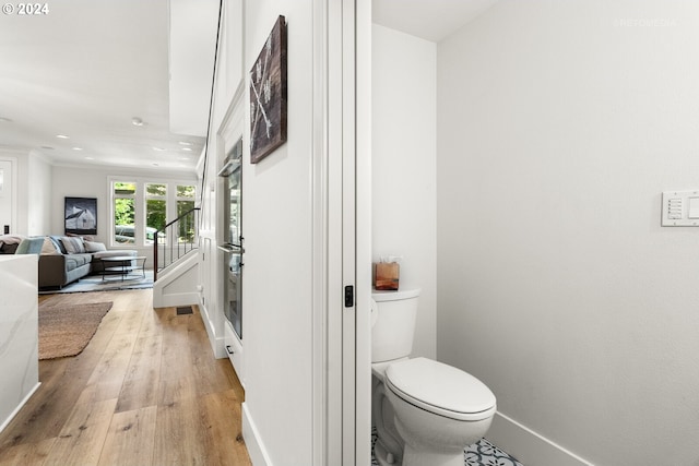 bathroom featuring toilet and hardwood / wood-style floors