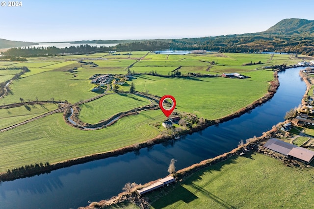 birds eye view of property featuring a rural view and a water view