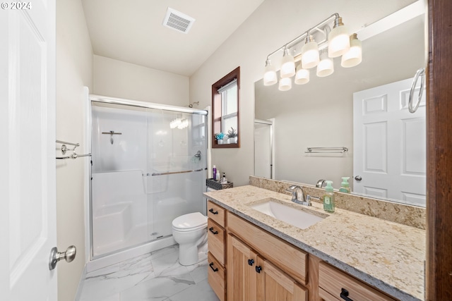 bathroom with vanity, toilet, and walk in shower