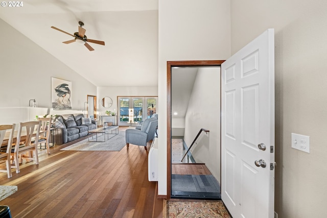 living room with ceiling fan, wood-type flooring, high vaulted ceiling, and french doors