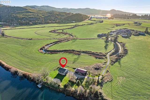 drone / aerial view featuring a rural view and a water and mountain view