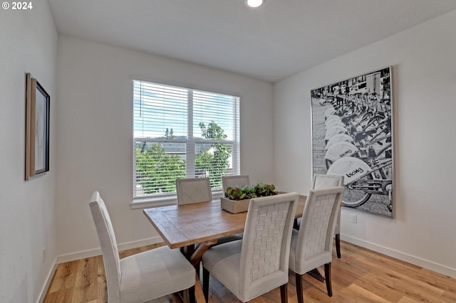 dining space with light wood-type flooring