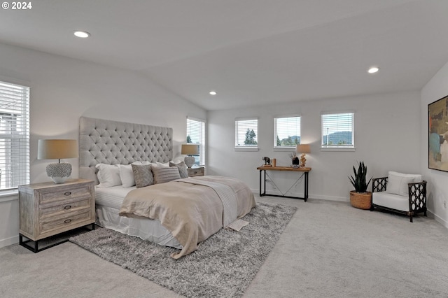 carpeted bedroom with vaulted ceiling