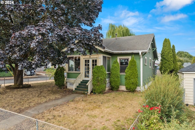 bungalow with a front yard