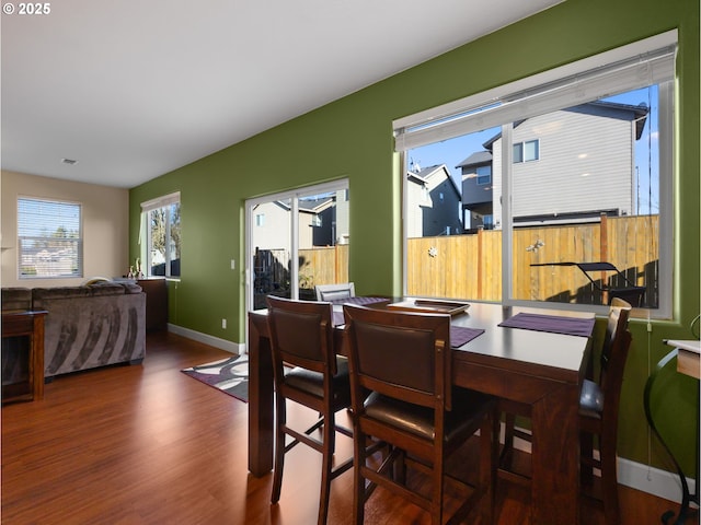 dining area featuring dark hardwood / wood-style flooring