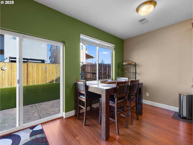 dining space featuring hardwood / wood-style flooring