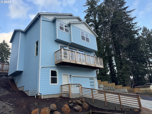 back of house with a balcony