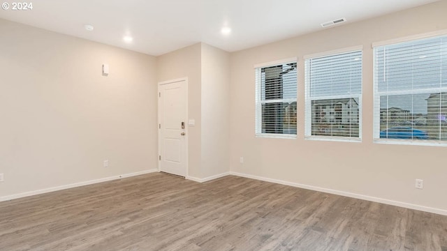 empty room with wood-type flooring