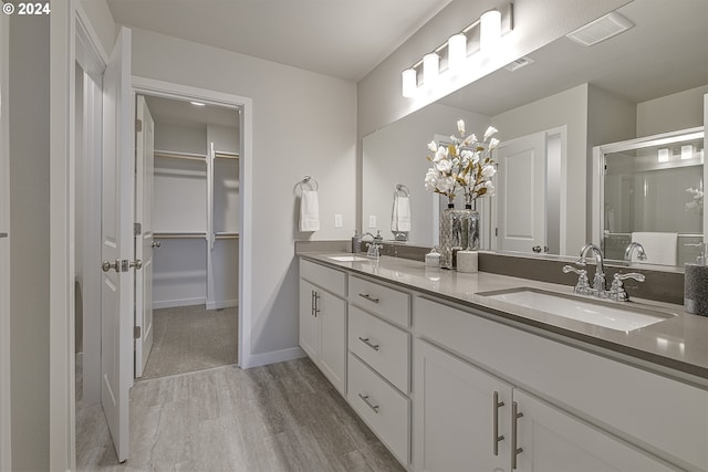 bathroom with vanity and wood-type flooring