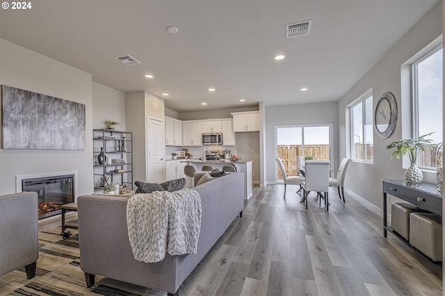 living room with light hardwood / wood-style floors