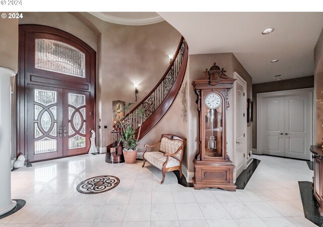 foyer entrance featuring stairway, french doors, tile patterned flooring, recessed lighting, and baseboards
