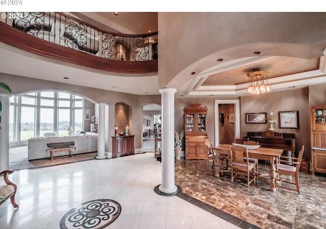 common area with a towering ceiling and recessed lighting