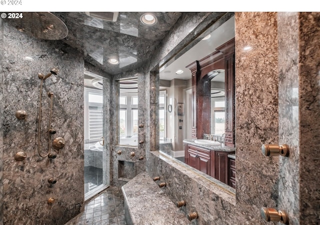 full bath with a shower and vanity