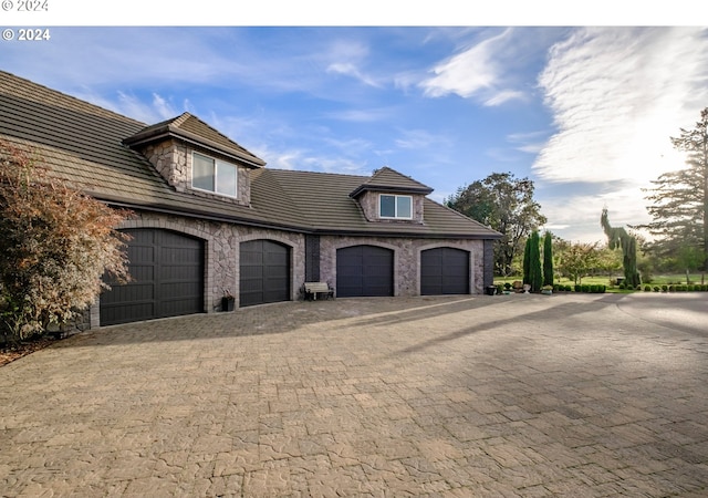 view of front facade featuring decorative driveway