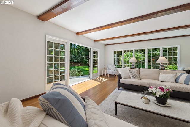 living room featuring beam ceiling and hardwood / wood-style flooring