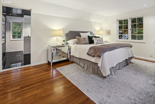 bedroom with dark wood-type flooring