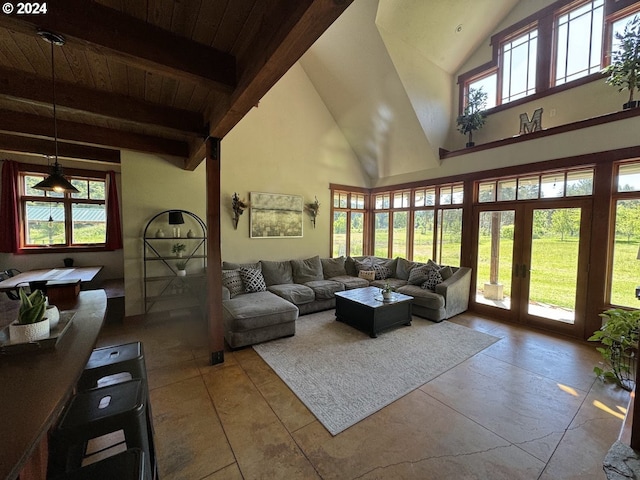 tiled living room featuring a wealth of natural light, beam ceiling, high vaulted ceiling, and wooden ceiling