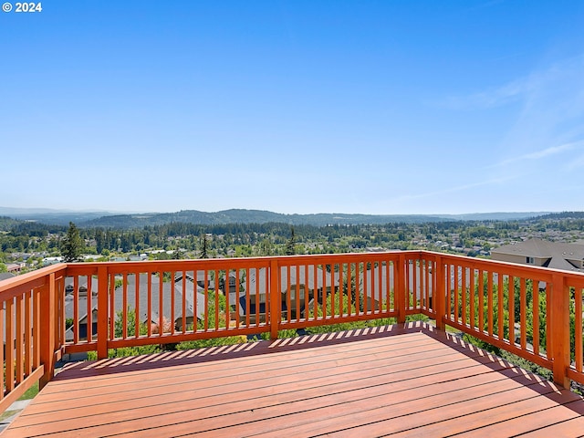 wooden deck featuring a mountain view