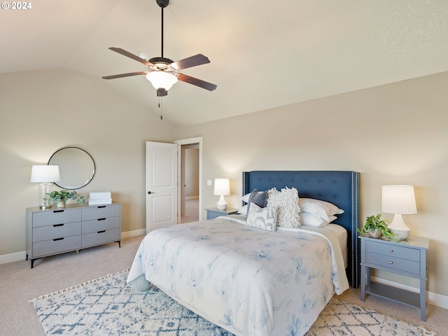 bedroom with light carpet, lofted ceiling, and ceiling fan