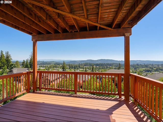 wooden deck with a mountain view