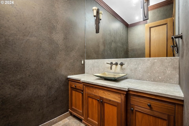 bathroom featuring ornamental molding, decorative backsplash, and vanity