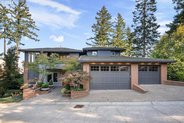 prairie-style home featuring a garage