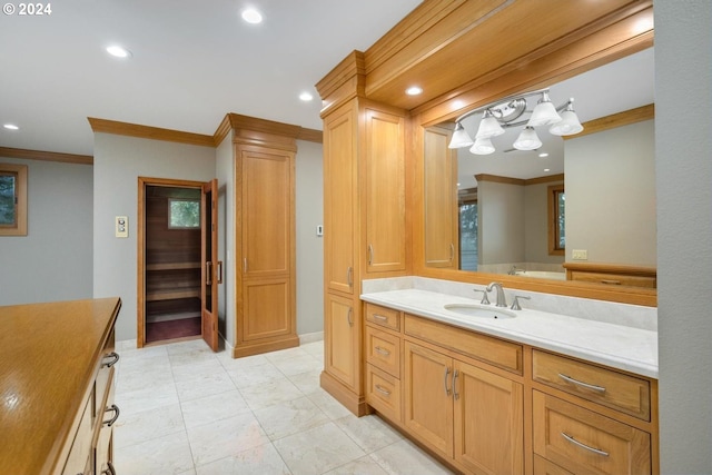 bathroom featuring ornamental molding and vanity