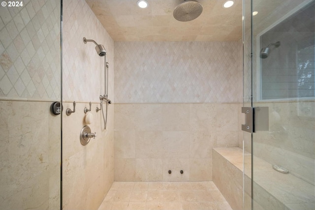 bathroom with walk in shower and tile patterned floors