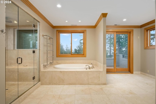 bathroom featuring separate shower and tub, ornamental molding, and a healthy amount of sunlight