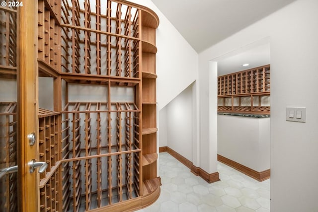 wine room with vaulted ceiling