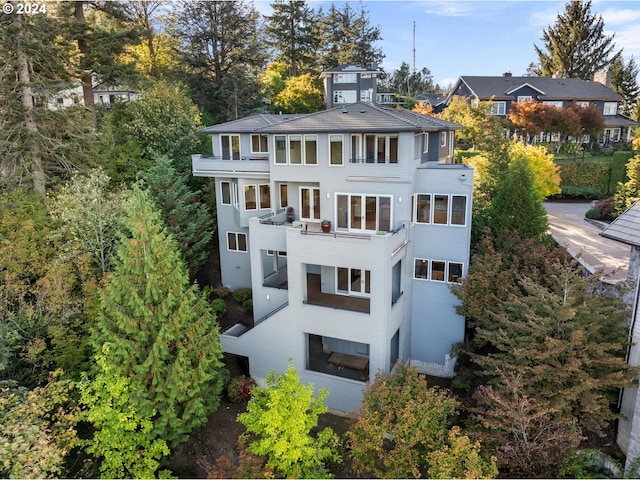 rear view of house with a balcony