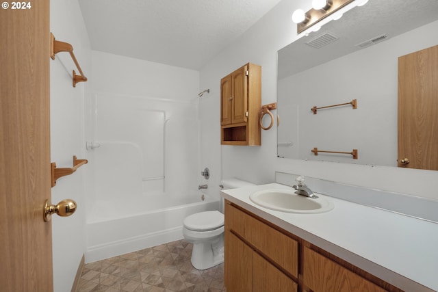 full bathroom with a textured ceiling, vanity, shower / bathtub combination, and toilet